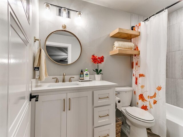 full bath with toilet, shower / tub combo, and vanity