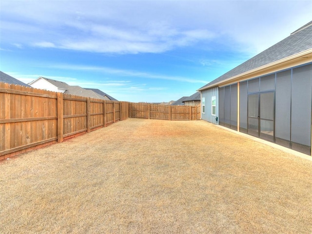 view of yard with a fenced backyard