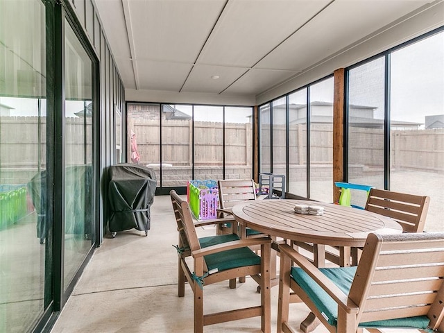 sunroom with outdoor dining space