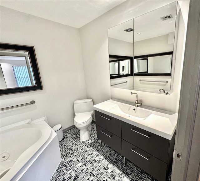 full bathroom with vanity, toilet, baseboards, and visible vents