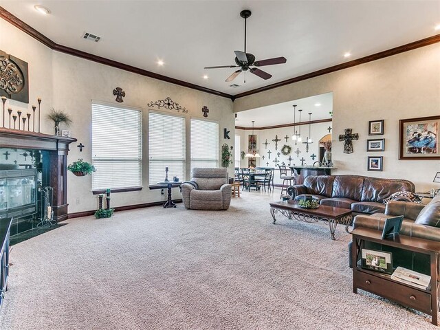 carpeted living room featuring crown molding, a ceiling fan, recessed lighting, and visible vents