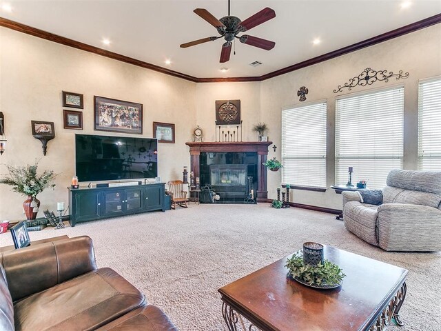 carpeted living room with crown molding, a ceiling fan, recessed lighting, a tile fireplace, and visible vents