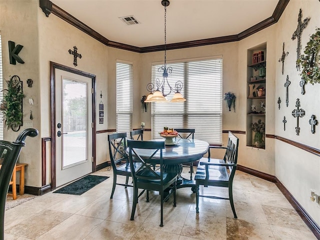 dining area featuring visible vents, ornamental molding, and baseboards
