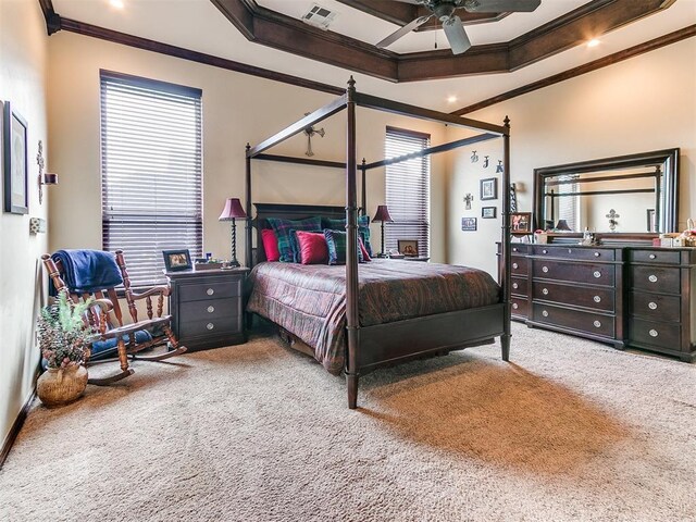 bedroom with crown molding, carpet flooring, ceiling fan, and visible vents