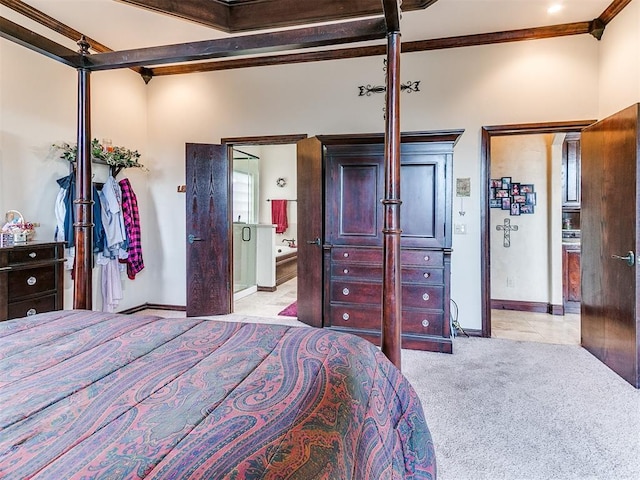 bedroom with crown molding, light tile patterned flooring, light carpet, ensuite bath, and baseboards