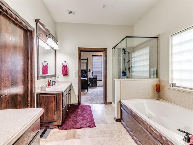 full bath with a bath, visible vents, a stall shower, vanity, and tile patterned floors