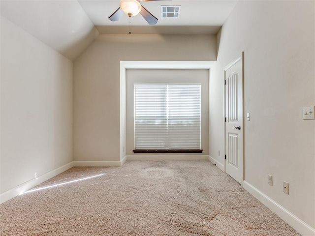 interior space featuring baseboards, a ceiling fan, carpet flooring, and visible vents