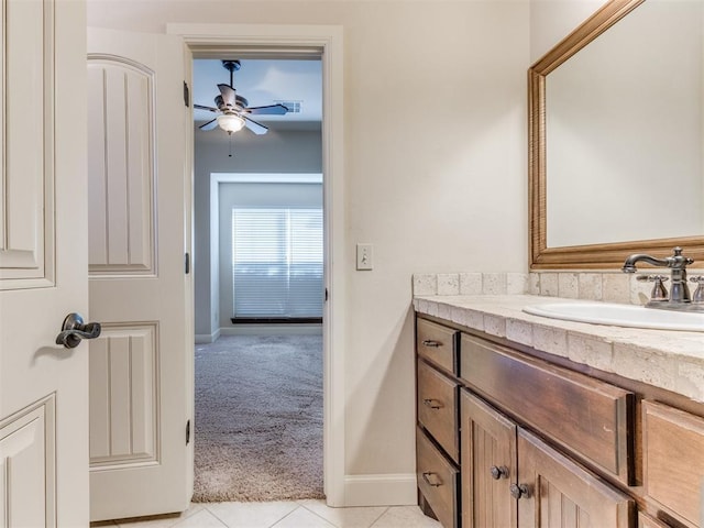 bathroom featuring ceiling fan, vanity, tile patterned floors, baseboards, and visible vents