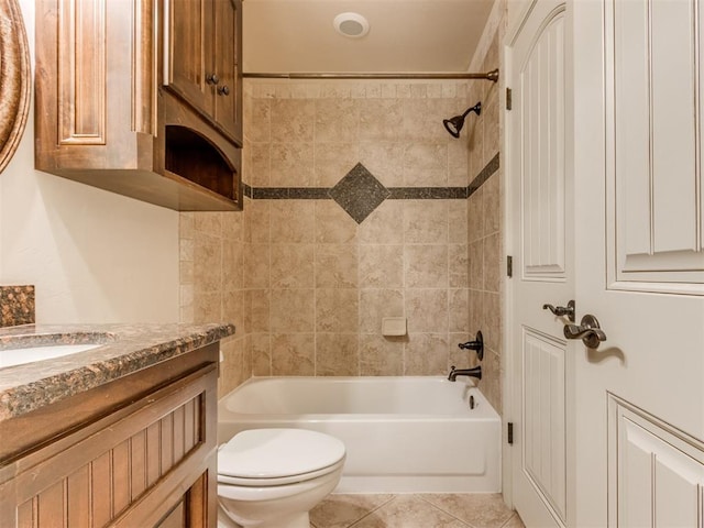 bathroom featuring toilet, tub / shower combination, tile patterned flooring, and vanity