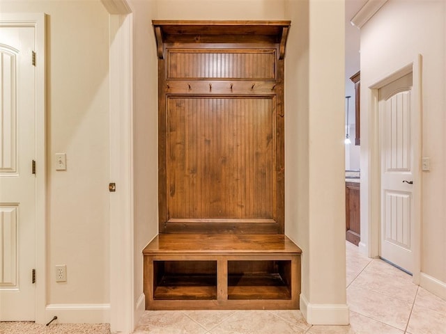 mudroom featuring baseboards and light tile patterned floors