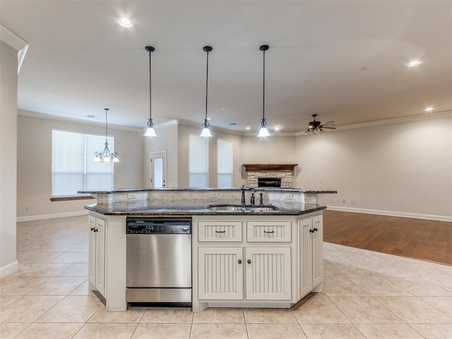 kitchen featuring a sink, crown molding, open floor plan, and dishwasher