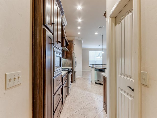 corridor with visible vents, light tile patterned floors, a notable chandelier, ornamental molding, and recessed lighting
