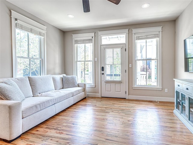 34 Boardwalk Unit B, Carlton Landing, OK 74432 - living area featuring baseboards, a ceiling fan, light wood finished floors, and a wealth of natural light