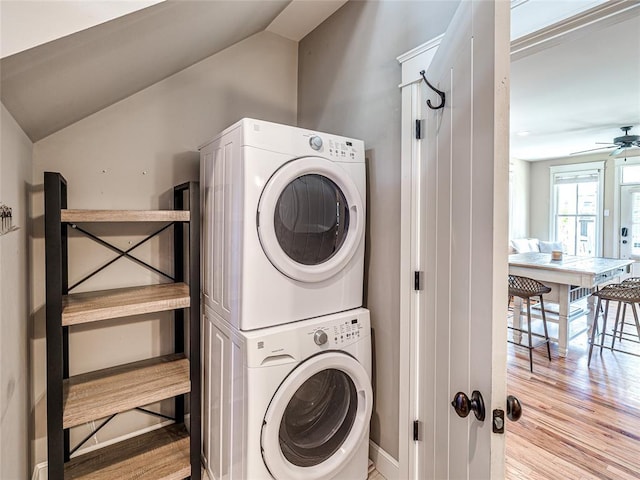 34 Boardwalk Unit B, Carlton Landing, OK 74432 - washroom with stacked washer and clothes dryer, a ceiling fan, wood finished floors, and laundry area
