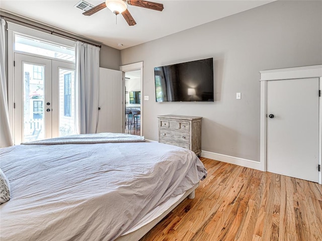 34 Boardwalk Unit B, Carlton Landing, OK 74432 - bedroom featuring french doors, visible vents, light wood-type flooring, baseboards, and access to outside