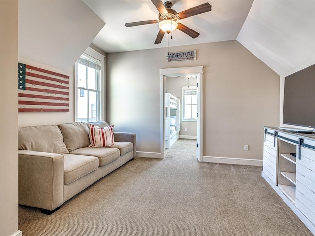 34 Boardwalk Unit B, Carlton Landing, OK 74432 - carpeted living room featuring baseboards, a ceiling fan, vaulted ceiling, and a wealth of natural light