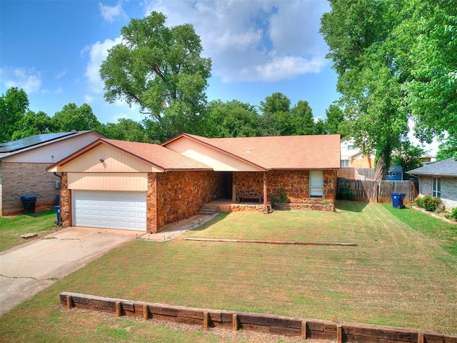 11817 Hollyrock Dr, Yukon, OK 73099 - ranch-style house featuring a garage, concrete driveway, and stone siding