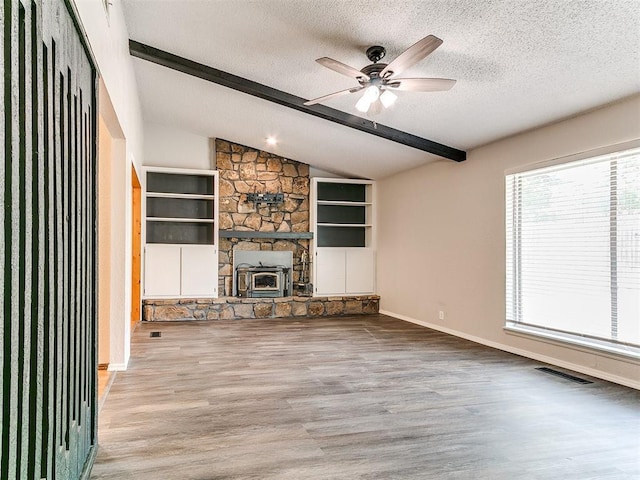 11817 Hollyrock Dr, Yukon, OK 73099 - unfurnished living room featuring a textured ceiling, wood finished floors, ceiling fan, and baseboards