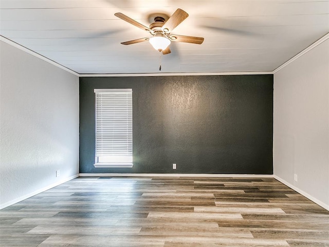 11817 Hollyrock Dr, Yukon, OK 73099 - spare room featuring crown molding, a ceiling fan, wood finished floors, and baseboards