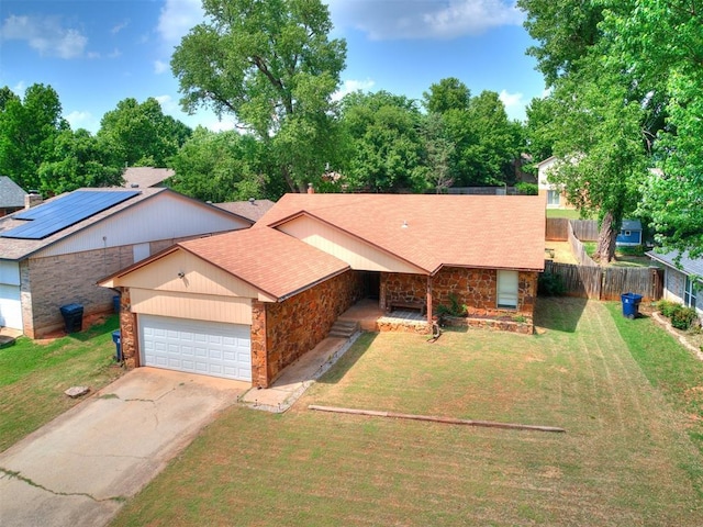 11817 Hollyrock Dr, Yukon, OK 73099 - view of front of house featuring an attached garage, stone siding, concrete driveway, and roof with shingles