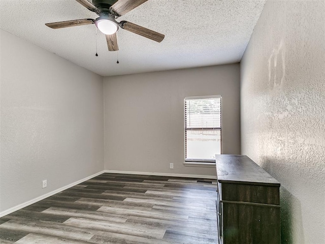 11817 Hollyrock Dr, Yukon, OK 73099 - empty room featuring wood finished floors, ceiling fan, a textured ceiling, and baseboards