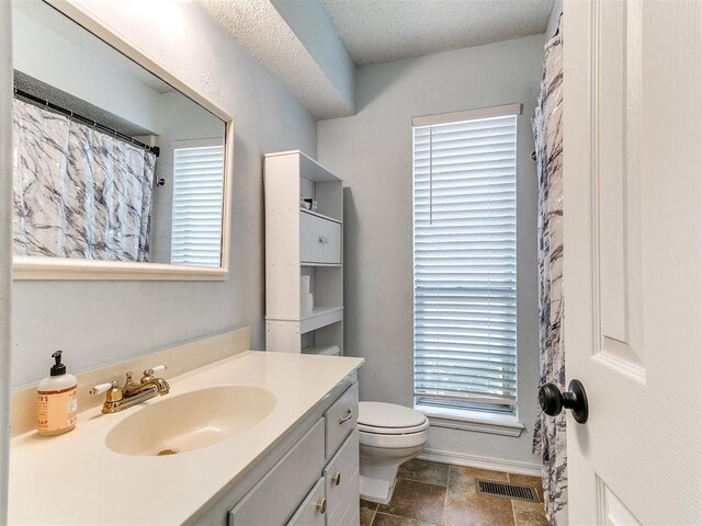 11817 Hollyrock Dr, Yukon, OK 73099 - bathroom featuring vanity and toilet