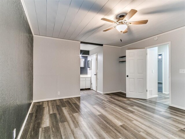 11817 Hollyrock Dr, Yukon, OK 73099 - spare room featuring wood finished floors, a ceiling fan, and crown molding