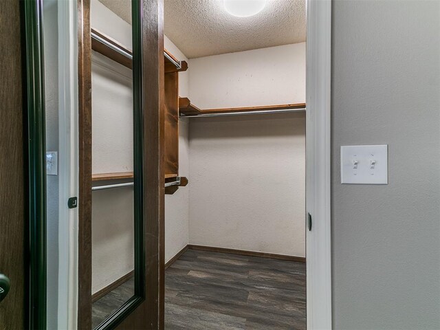 11817 Hollyrock Dr, Yukon, OK 73099 - spacious closet with dark wood finished floors