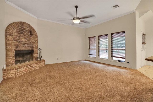 8713 Starling Path, Edmond, OK 73034 - unfurnished living room with carpet floors, ceiling fan, ornamental molding, and a brick fireplace