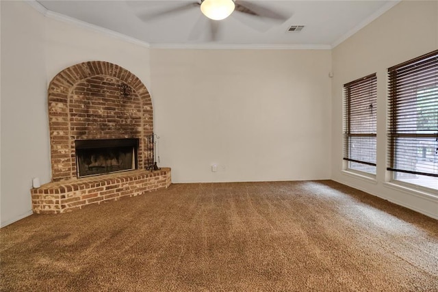8713 Starling Path, Edmond, OK 73034 - unfurnished living room with a ceiling fan, carpet flooring, ornamental molding, and a fireplace
