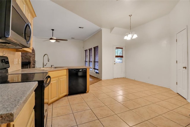8713 Starling Path, Edmond, OK 73034 - kitchen featuring black appliances, a sink, a ceiling fan, a chandelier, and a peninsula