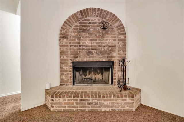 8713 Starling Path, Edmond, OK 73034 - detailed view of carpet flooring, a fireplace, and baseboards