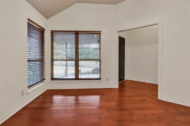 8713 Starling Path, Edmond, OK 73034 - spare room featuring lofted ceiling and wood finished floors