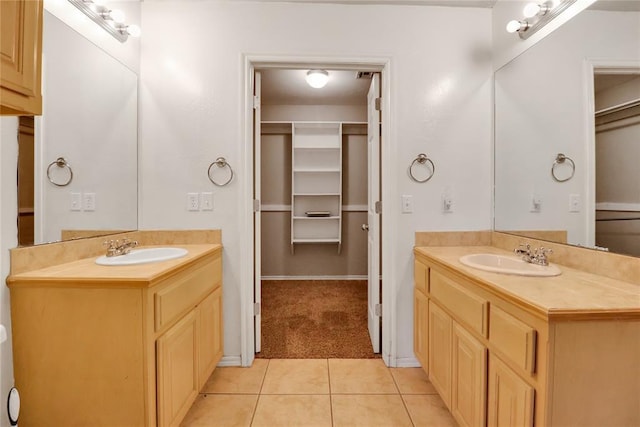 8713 Starling Path, Edmond, OK 73034 - full bathroom featuring two vanities, tile patterned floors, and a walk in closet