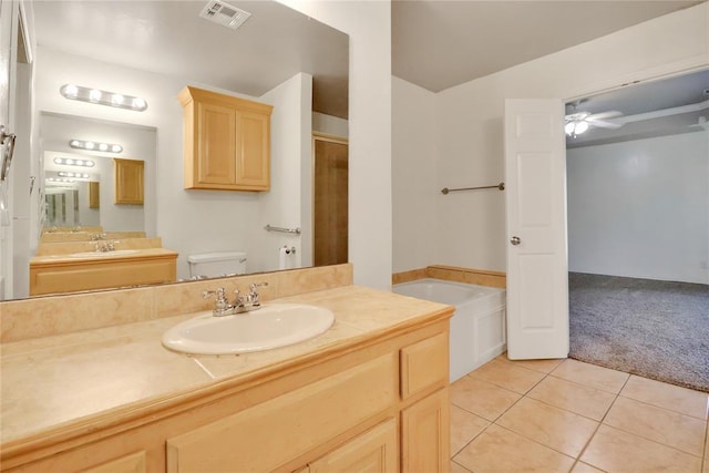 8713 Starling Path, Edmond, OK 73034 - full bathroom with a shower stall, a garden tub, tile patterned flooring, vanity, and toilet