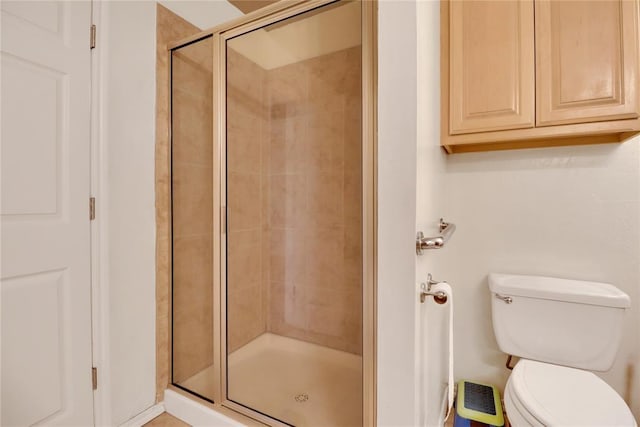 8713 Starling Path, Edmond, OK 73034 - bathroom featuring a stall shower and toilet