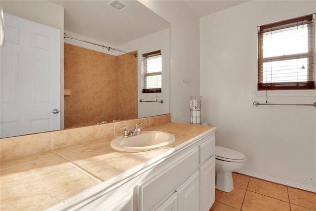 8713 Starling Path, Edmond, OK 73034 - bathroom featuring toilet, tile patterned floors, vanity, and a shower