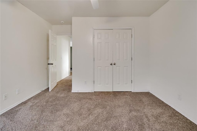 8713 Starling Path, Edmond, OK 73034 - unfurnished bedroom with carpet flooring, a closet, baseboards, and ceiling fan