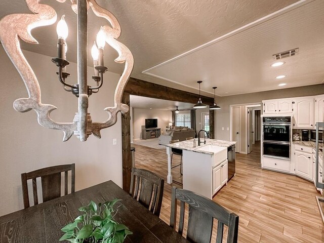 dining space featuring visible vents, recessed lighting, and light wood-style floors