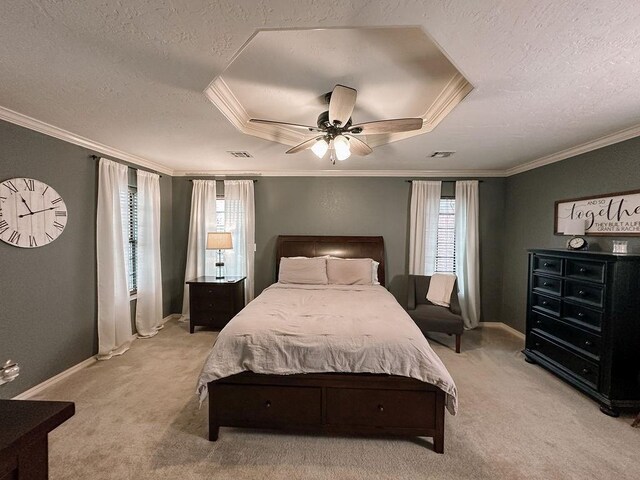 bedroom featuring baseboards, a textured ceiling, light carpet, and ornamental molding