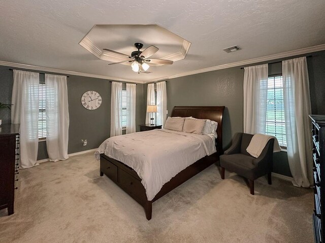bedroom with visible vents, light carpet, and ornamental molding