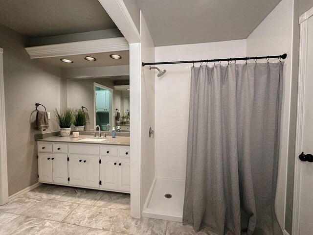full bath featuring vanity, recessed lighting, baseboards, and a shower stall