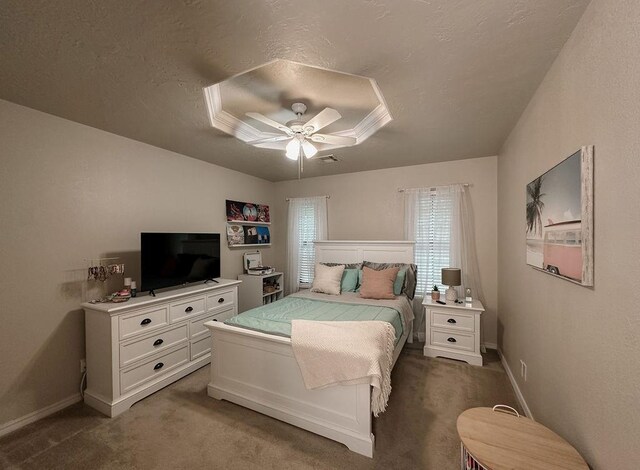 bedroom with carpet floors, a textured ceiling, ceiling fan, and baseboards
