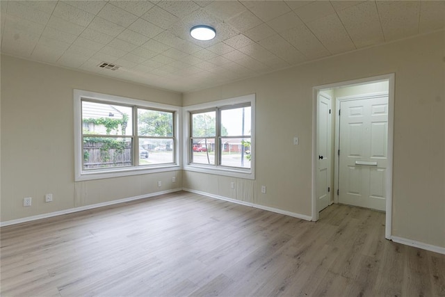 624 SW 44th St, Oklahoma City, OK 73109 - unfurnished room with baseboards, wood finished floors, and visible vents