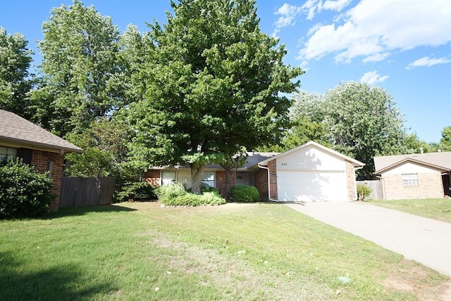 305 Cherryvale Rd, Edmond, OK 73003 - view of front of house with an attached garage, concrete driveway, and brick siding