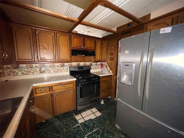 kitchen featuring stainless steel fridge with ice dispenser, black range with gas stovetop, under cabinet range hood, and brown cabinetry