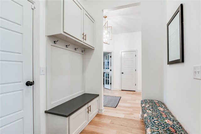 mudroom with light wood-style flooring