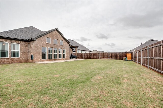 view of yard with a fenced backyard