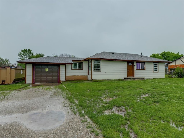 single story home featuring a front lawn and driveway