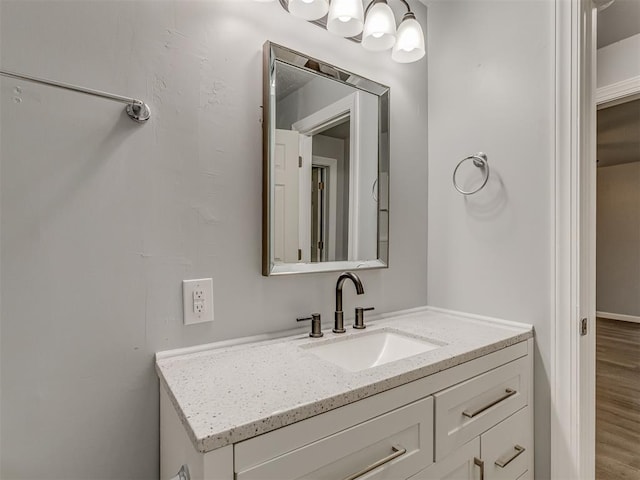 bathroom with vanity and wood finished floors